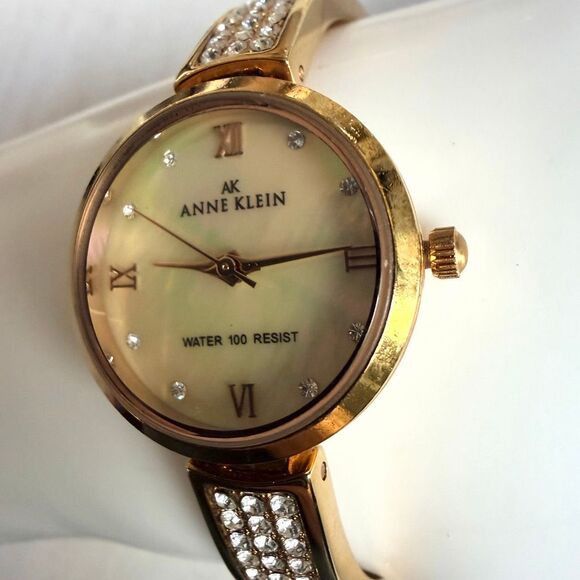 Anne Klein AK Gold Tone Watch Mother of Pearl Dial Crystal Accents Water Resist